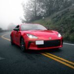 A Red Toyota GR86 on an Asphalt Road