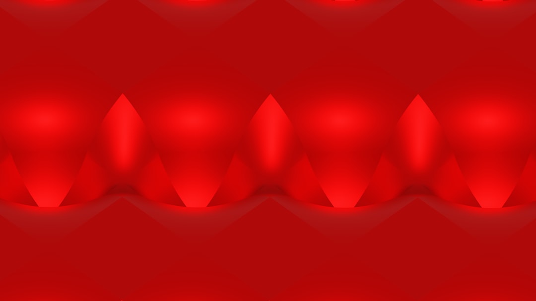 a red abstract background with shiny shapes