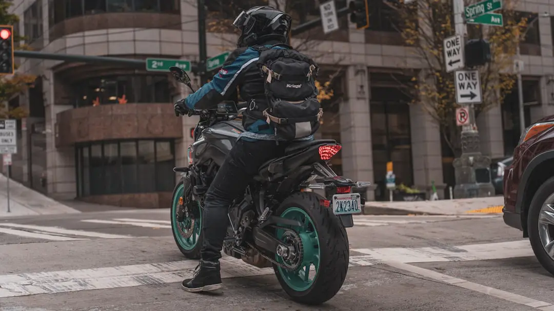 a person riding a motorcycle on a city street