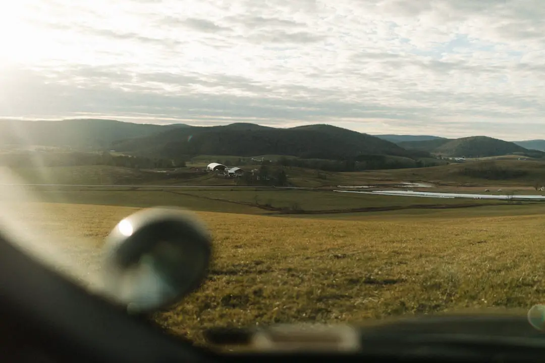 a view of a field from a vehicle
