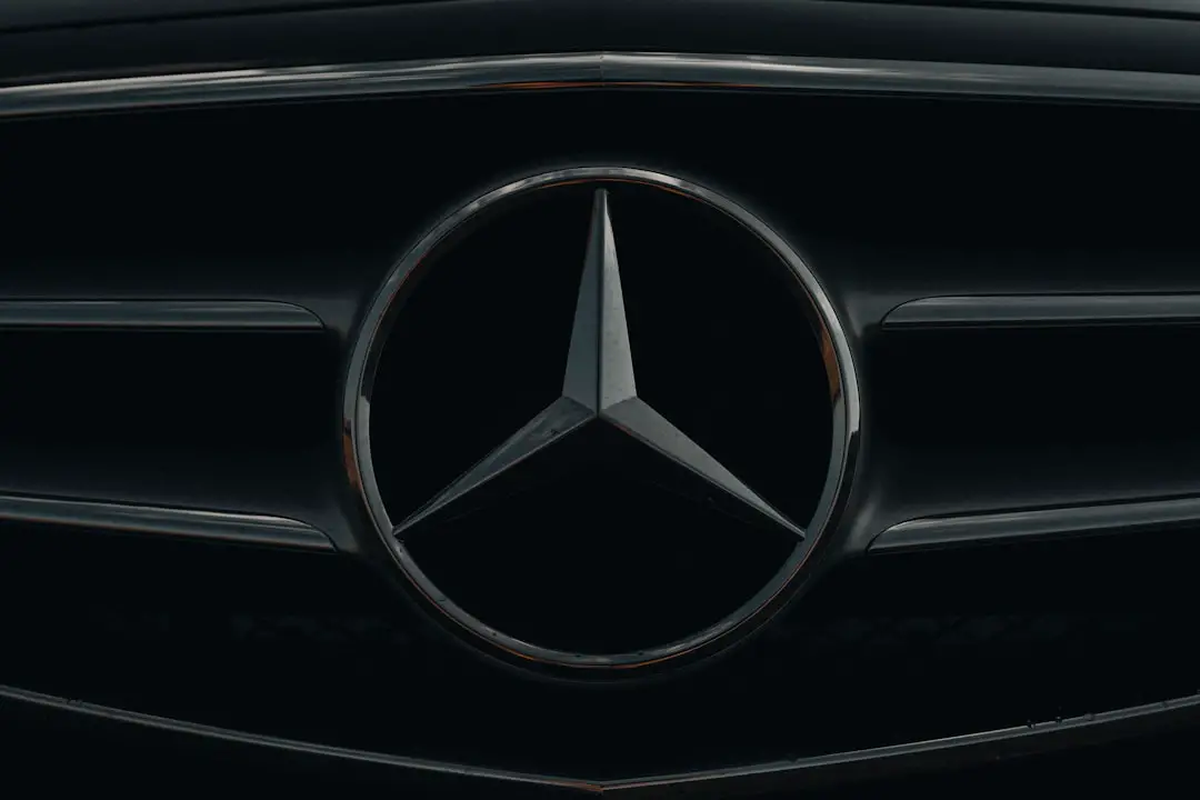 a close up of a mercedes logo on a car