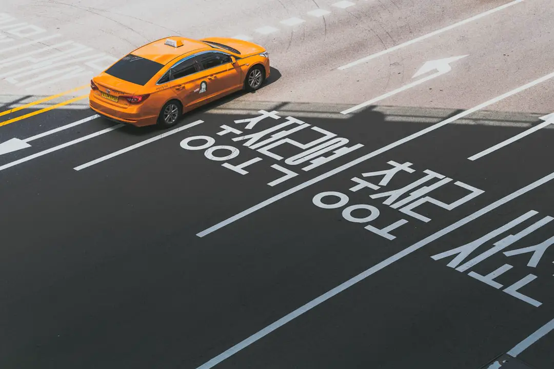 orange sedan with text overlay