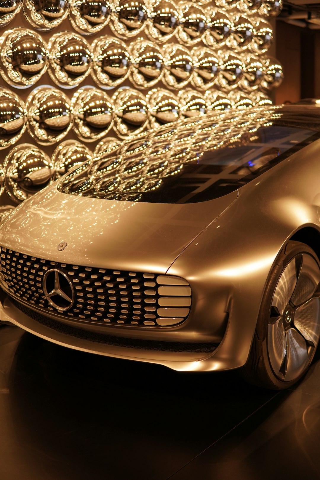 a mercedes concept car on display in a showroom