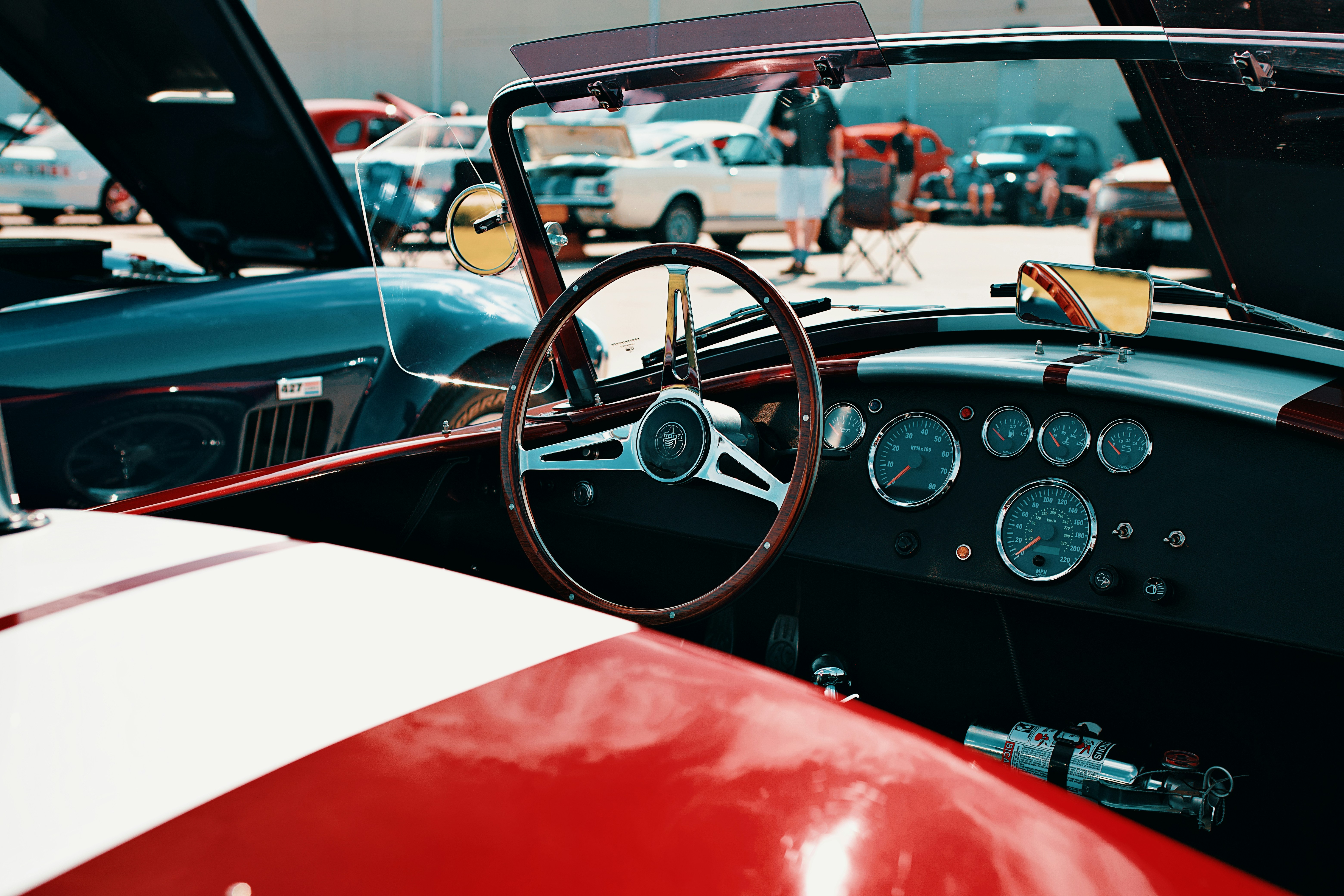 Classic car's interior and dashboard are displayed.